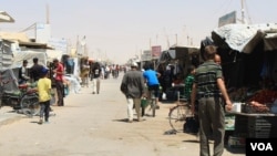 FILE - Refugee camps in Jordan, Turkey and Lebanon have grown into villages and towns. But residents say without many resources or rights, there is no future in the camps. Zaatari Camp, Jordan. (H. Murdock/VOA)
