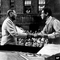 Duke Ellington, left, and jazz pianist Billy Taylor shake hands on New York's Jazzmobile during a visit by the Ellington Band to the city's Harlem section in the early 1970s