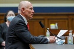 Michael Bowen of Prestige Ameritech testifies before a House Energy and Commerce subcommittee to discuss protecting scientific integrity in response to the coronavirus outbreak, May 14, 2020, on Capitol Hill in Washington.