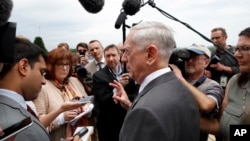 Defense Secretary Jim Mattis speaks with the media at the Pentagon, June 20, 2018, in Washington.