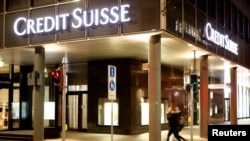 FILE - The logo of Swiss bank Credit Suisse is seen at a branch office in Basel, Switzerland March 2, 2020.
