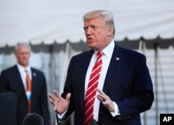 FILE - President Donald Trump speaks to reporters before leaving the White House in Washington, Oct. 7, 2017.