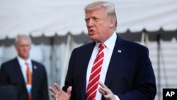 Police in riot gear stand guard as they face pro-democracy protesters during a rally in Bangkok, Thailand.