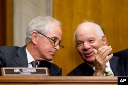 Chairman Bob Corker, R-Tenn., left, and ranking member Ben Cardin, D-Md., confer as the State Department's Thomas Shannon testifies at a Senate Foreign Relations Committee hearing on Capitol Hill in Washington, April 5, 2016.