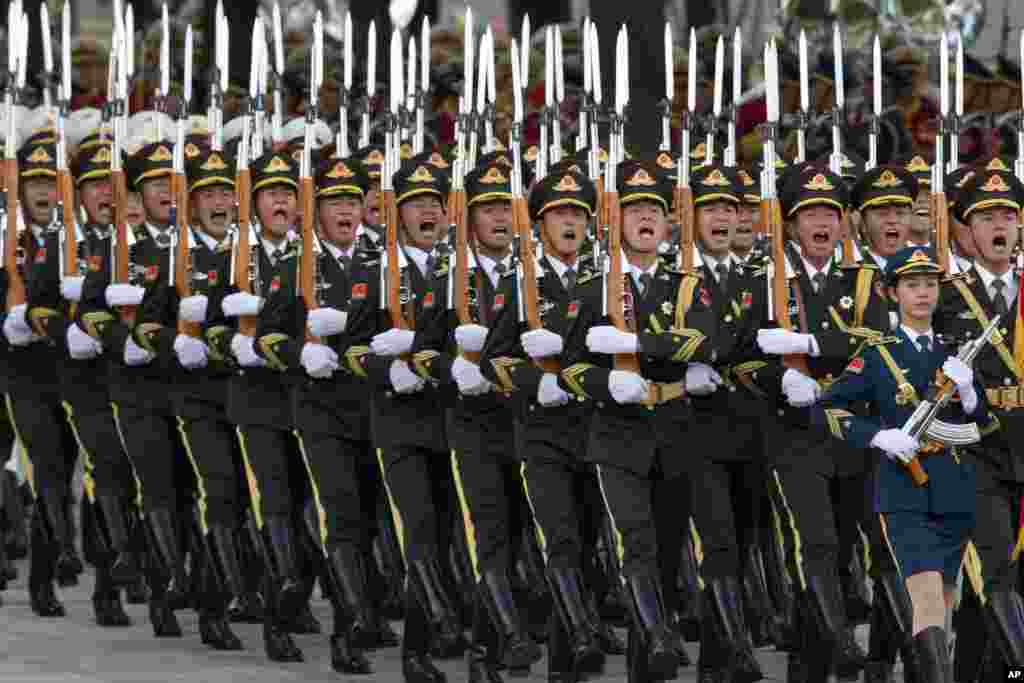 Members of a Chinese guard of honor march during a welcome ceremony for Dutch King Willem-Alexander outside the Great Hall of the People in Beijing.