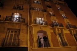 Parisians applaud the caregivers and police for their work, Paris, France, March 18, 2020.