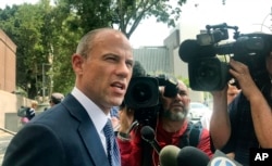 FILE - Lawyer Michael Avenatti talks to the media outside of Los Angeles County Superior Court after a hearing in Los Angeles, July 10, 2018.