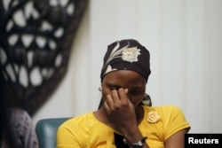 Rebecca Issac, a Chibok schoolgirl who had escaped from the Boko Haram, reacts during an event that marks the second anniversary of the Boko Haram abduction of Chibok schoolgirls, in Abuja, Nigeria, April 11, 2016.