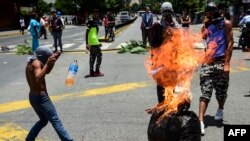 Anti-government activists demonstrate against Venezuelan President Nicolas Maduro at a barricade set up on a road in Caracas on Aug. 8, 2017.
