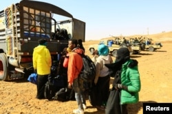 Illegal immigrants and traffickers are caught while traveling in a remote desert area en route to Libya, at Omdurman, Sudan, Jan. 8, 2017.