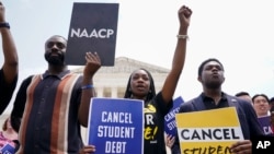 FILE - Students demonstrates about student loan debt outside the Supreme Court, June 30, 2023, in Washington. Biden is traveling to Wisconsin April 8 2024, to announce details of a new plan to help millions of people with their student loan debt. 