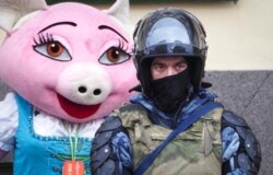 A Russian Rosguardia (National Guard) soldier stands at a central avenue in front of a restaurant promoter, a day before a planned protest in St. Petersburg, Russia, Jan. 30, 2021.