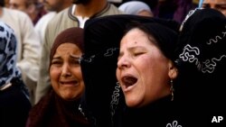 Egyptian women weep after a judge sentenced to death more than 680 alleged supporters of the country’s ousted president over acts of violence and the murder of a policeman in the latest mass trial in the southern city of Minya, Egypt, April 28, 2014.