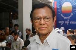 FILE - Opposition party Cambodia National Rescue Party (CNRP) President Kem Sokha adressess party supporters during the party's political congress in Phnom Penh, Cambodia, March 2, 2017.