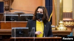 FILE - Michigan Gov. Gretchen Whitmer speaks at the state Capitol in Lansing, Michigan, Dec. 14, 2020. 
