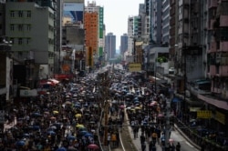 Protesters gather in Yuen Long district in Hong Kong, July 27, 2019. Crowds of Hong Kong protesters defied a police ban and gathered in a town near the Chinese border to rally against suspected gangs who beat up pro-democracy demonstrators there.