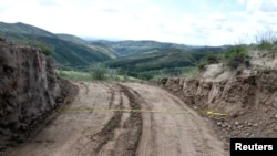 View of a dirt road passing through a damaged section of the Great Wall of China, in Youyu County, Shuozhou City, Shanxi Province, China, in this still image released on Aug. 31, 2023. Youyu County Public Security Bureau/Handout via REUTERS. 