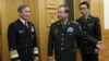 U.S. Navy Admiral Harry B. Harris, Jr., Commander U.S. Pacific Command (L) is shown the way by China's PLA Chief of Staff General Fang Fenghui (C) as they proceed to their meeting at the Bayi Building in Beijing, China, Nov. 3, 2015.