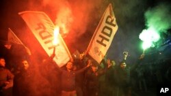 FILE - People's Democratic Party supporters celebrate after the announcement of preliminary results of local elections in Diyarbakir, Turkey, March 31, 2019. 
