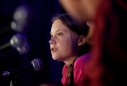 Swedish climate activist Greta Thunberg speaks with other child petitioners from 12 countries who presented a landmark complaint to protest the lack of government action on the climate crisis during a press conference in New York, Sept. 23, 2019.