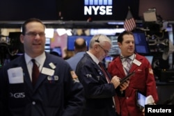Traders work on the floor of the New York Stock Exchange shortly after the opening bell in New York, Jan. 13, 2017.