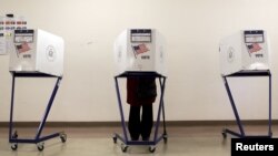 A voter is seen at a polling station during the New York primary elections in the Manhattan borough of New York City, April 19, 2016. Many voters in New York state complained of technical problems and disenfranchisement.