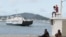 FILE - A boat arrives at Dzaoudzi on the Indian Ocean island of Mayotte, March 31, 2012. The Somali government said, Nov. 25, 2024, it will begin evacuating the survivors of two boats, carrying mostly Somali migrants, which capsized off the coast of Madagascar on Nov. 23.