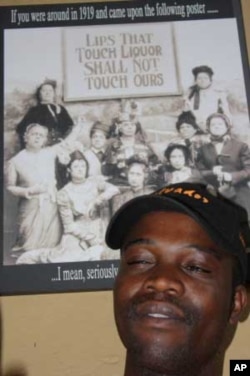 Harvest Kalimanjira takes a break from his duties inside the bar at Kaapsche Hoop....He says he and his brothers are in South Africa to make "20 times more money" than they would in Malawi