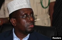 Somalia's former President Sharif Sheikh Ahmed follows the proceedings after a new president was elected, in Mogadishu, Sept. 10, 2012.