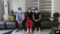 Ma Seo-bin, center, a high school senior at an elite, speaks in between her father Ma Moon Young, left, and mother Choi Hae-jeong during an interview at their home in Siheung, South Korea, on Sept. 19, 2020. “I felt I was trapped at the same place and I g