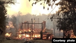 ရခိုင်ပြည်နယ်၊ ကျောက်ဖြူမြို့နယ် ဦးကင်းကျေးရွာကို စစ်ကောင်စီတပ်က ဒရုန်းနဲ့ဗုံးကြဲခံရပြီး လူနေအိမ်တွေ မီးလောင်နေပုံ။ ( Photo Crd -APM/မတ်လ ၆၊ ၂၀၂၅ )