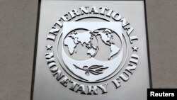 FILE - The International Monetary Fund (IMF) logo is seen at the IMF headquarters building. 