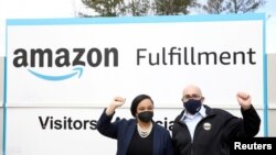 U.S. Rep. Nikema Williams and Stuart Appelbaum, head of the Retail, Wholesale and Department Store Union, are pictured March 5, 2021, at an Amazon facility in Bessemer, Ala., where workers are deciding whether to unionize.
