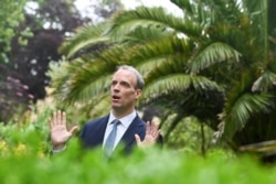 Britain's Foreign Secretary Dominic Raab gestures during an interview with Reuters on the sidelines of G7 summit in Carbis Bay, Cornwall, Britain, June 11, 2021.