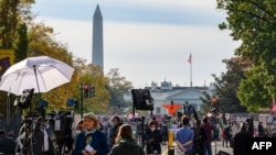 Journalists from all over the world wait for the result of the U.S. presidential elections on Black Lives Matter Plaza in front of the White House in Washington, D.C., Nov. 6, 2020.