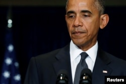 FILE - U.S. President Barack Obama delivers remarks on the police shootings in Dallas after meeting with EU leaders at the NATO Summit in Warsaw, Poland, July 8, 2016.