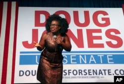 Actress Uzo Aduba speaks during a rally for Democratic candidate for U.S. Senate Doug Jones, Monday, Dec. 11, 2017, in Birmingham, Alabama. Jones defeated Republican Roy Moore.