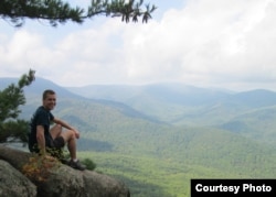 Sitting on rock: Hiking toward the top of Old Rag Mountain in Shenandoah National Park in October 2014.