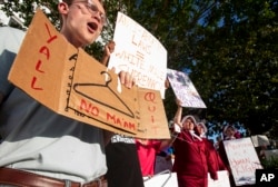 Dana Sweeney chants during a rally against a ban on nearly all abortions outside of the Alabama State House in Montgomery, Ala., on Tuesday, May 14, 2019. (Mickey Welsh/The Montgomery Advertiser via AP)