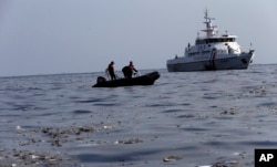 Rescuers search for victims of Lion Air passenger jet that crashed in the waters of Ujung Karawang, West Java, Indonesia, Monday, Oct. 29, 2018.