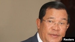 Cambodia's Prime Minister Hun Sen arrives before a plenary session at the National Assembly of Cambodia, in Phnom Penh, Jan. 31, 2017.