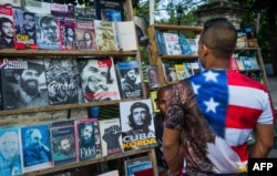 A Cuban man wearing a T-shirt with the U.S. flag walks along a street in Havana, Jan. 16, 2015.
