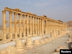 FILE - This colonnade in the historical city of Palmyra, Syria, was among cultural sites destroyed by the Islamic State group in 2015.