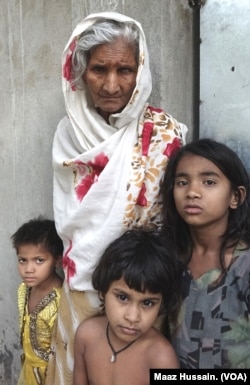Some Rohingya children and a woman at an unidentified refugee colony in West Bengal, eastern India (April 2018).