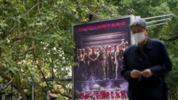 A poster advertising "The Battle at Lake Changjin," a film about Chinese soldiers fighting American troops during the Korean War, is displayed at a movie theater in Shanghai, China October 19, 2021.