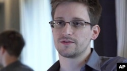 Edward Snowden, who worked as a contract employee at the National Security Agency, speaks to The Guardian newspaper in Hong Kong, June 9, 2013.