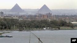 A traditional felucca sailing boat transits the Nile river passing the Pyramids of Giza in Cairo, Egypt. (file photo)