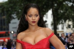 Rihanna poses for photographers as she arrives for the European film premiere of 'Valerian and the City of a Thousand Planets' in London, July 24, 2017.