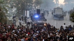 Protesters clash with police in the streets of Algiers, Algeria, during a demonstration denouncing President Abdelaziz Bouteflika's bid for a fifth term, March 1, 2019.
