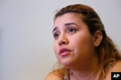 Itzel, 23, who was brought to the U.S. as a child from Mexico, speaks during an interview with The Associated Press in Homestead, Fla.